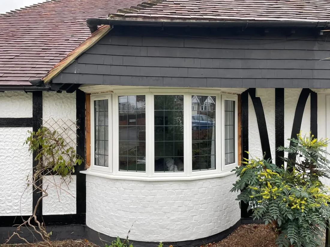 Bay window and porch on a rendered home Everglaze Window Solutions Portsmouth