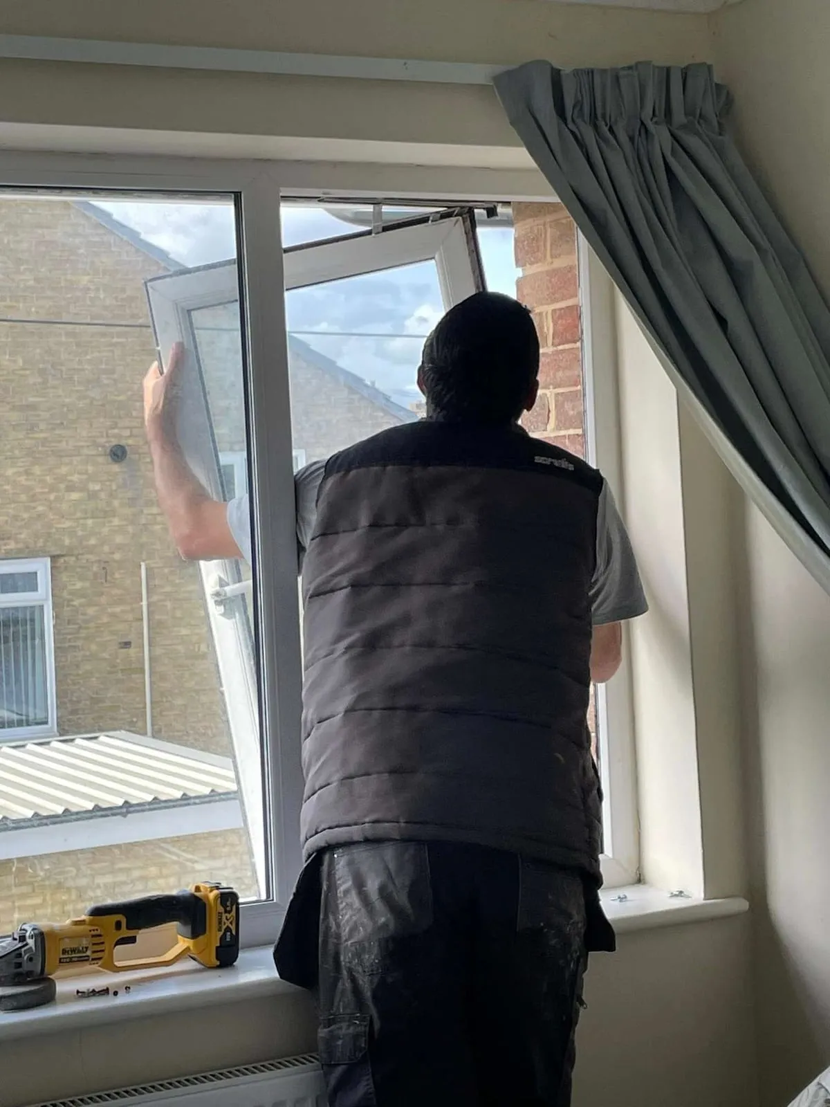 Everglaze fitter sealing a newly installed window Everglaze Window Solutions Portsmouth