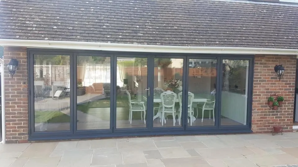 Sliding patio doors opening onto a garden Everglaze Window Solutions Portsmouth